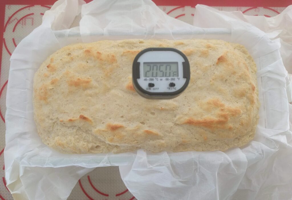 checking the temperature of keto bread