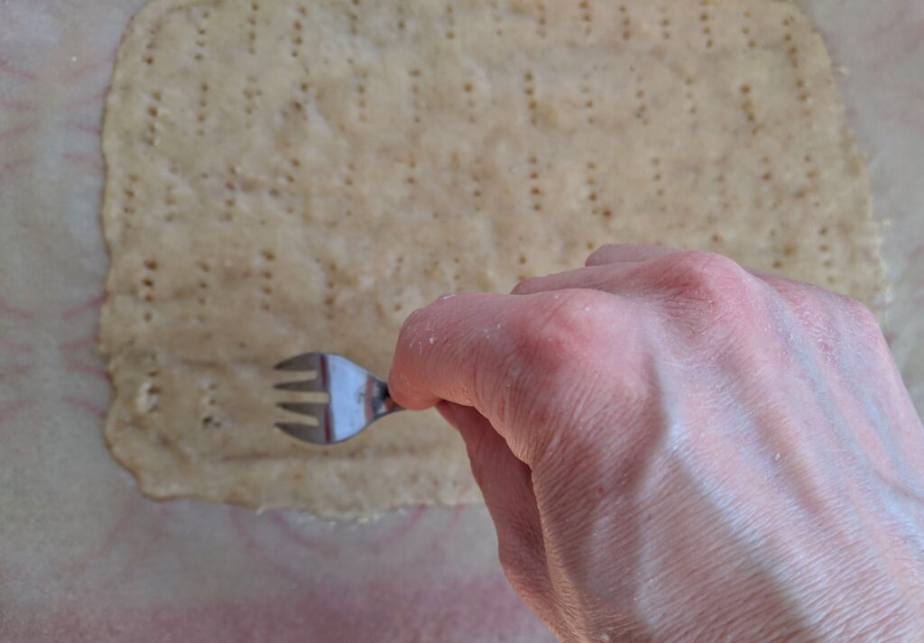 Pricking Collagen Thins dough with fork